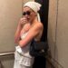 Hailey Bieber styled a lace lingerie-inspired skirt set from Magda Butrym with the triangle hair scarf trend and a new Chanel bag