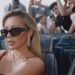Image may contain: Hilary Duff, Accessories, Sunglasses, Person, Photobombing, Electronics, Mobile Phone, Phone, and Glasses