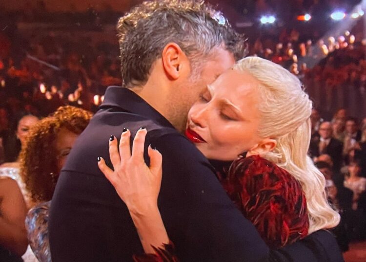 Lady Gaga and Michael Polansky embracing at the Grammys