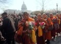Buddhist monks walk near the U.S. Capitol, on Capitol Hill, during the Walk For Peace, Wednesday, Feb. 11, 2026, in Washington. (AP Photo/Rahmat Gul)