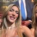 Two women with pained and surprised expressions react to a performance.