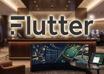 Flutter Entertainment branding over a casino-style sportsbook setting with betting screens and a tablet showing an online wagering interface.