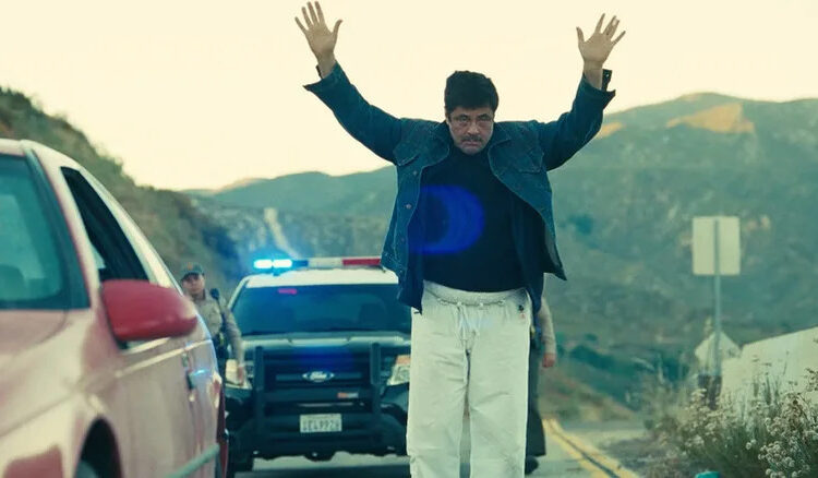 Sensei Sergio dance-walking in front of the cops in One Battle After Another