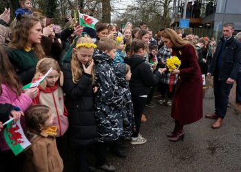 the princess engages with the crowd in newtown, powys