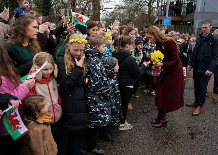 the princess engages with the crowd in newtown, powys