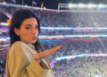 Jenner, 30, moved minimally to the music, wearing a black cropped top and blue jeans, while Bieber, 29, stood close in her white fur puffer and jeans.