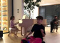 Reign Disick appears to ride an electric suitcase as Chicago West plays piano Kim Kardashian/Instagram