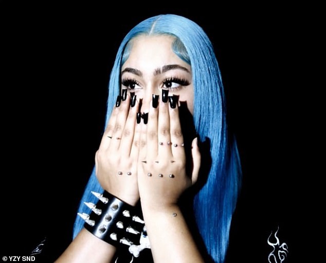 North West took to Instagram this week to reveal even more apparent body modifications after previously being criticized – and she surprised her fans by releasing a new song called PIERCING ON MY HAND on Friday; pictured in the single artwork