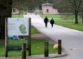 Police officers walk the road to the Royal Lodge in Windsor on Thursday.