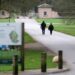 Police officers walk the road to the Royal Lodge in Windsor on Thursday.
