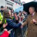 king charles shakes hands during city visit