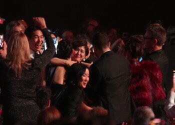 The team from KPop Demon Hunters react in the audience to winning the award for best song written for visual media for "Golden" during the 68th annual Grammy Awards on Sunday, Feb. 1, 2026, in Los Angeles. (AP Photo/Chris Pizzello)