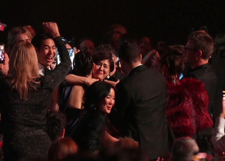 The team from KPop Demon Hunters react in the audience to winning the award for best song written for visual media for "Golden" during the 68th annual Grammy Awards on Sunday, Feb. 1, 2026, in Los Angeles. (AP Photo/Chris Pizzello)