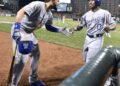 Kansas City Royals first baseman Eric Hosmer, left, congratulated Terrance Gore after Gore scored on a double by Alcides Escobar for the go-ahead run in the ninth inning of an ALCS game against the Orioles at Camden Yards in Baltimore, Maryland on Oct. 11, 2014.