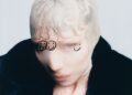 Image may contain Dale Bozzio Face Head Person Photography Portrait Baby Skin and Tattoo