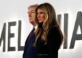President Donald Trump and first lady Melania Trump arrive for the premiere of her movie "Melania" at The John F. Kennedy Memorial Center For The Performing Arts, Thursday, Jan. 29, 2026, in Washington. (AP Photo/Jose Luis Magana)