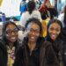three students celebrate Black History Month