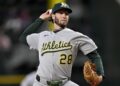 May 1, 2025; Arlington, Texas, USA; Athletics relief pitcher Mitch Spence (28) pitches against the Texas Rangers during the seventh inning at Globe Life Field. Mandatory Credit: Jerome Miron-Imagn Images