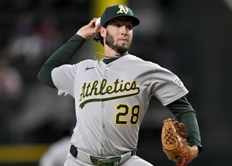 May 1, 2025; Arlington, Texas, USA; Athletics relief pitcher Mitch Spence (28) pitches against the Texas Rangers during the seventh inning at Globe Life Field. Mandatory Credit: Jerome Miron-Imagn Images