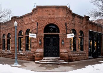 historic building with storefronts and snowcovered surroundings