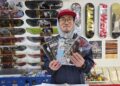 Victor Ha shows off zines available for purchase at Spin and Grind in western Seoul's Sinchon area, Feb. 22. Korea Times photo by Jon Dunbar