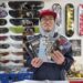 Victor Ha shows off zines available for purchase at Spin and Grind in western Seoul's Sinchon area, Feb. 22. Korea Times photo by Jon Dunbar
