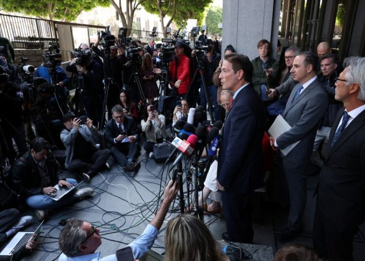 Los Angeles County District Attorney Nathan Hochman speaking with reporters after Nick Reiner's arraignment outside of a Los Angeles courthouse on Monday.