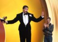 Bad Bunny accepts the album of the year Grammy at the end of the award ceremony in Los Angeles on Sunday night. It is the first time a Spanish-language album has claimed the Recording Academy’s top prize.