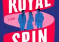 Illustration of the book cover "Royal Spin" by Omid Scobie and Robin Benway, featuring a blue Buckingham Palace with a Union Jack flag, a pink ribbon with the title text "ROYAL SPIN" in white, and three blue figures of people.