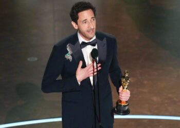Adrien Brody accepts the award for best performance by an actor in a leading role for "The Brutalist" during the Oscars on March 2, 2025, at the Dolby Theatre in Los Angeles. (AP Photo/Chris Pizzello)