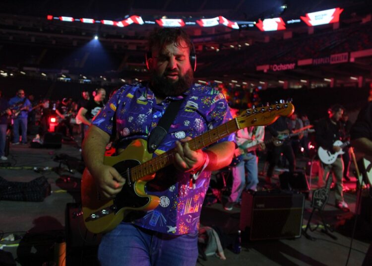 Playing Guitar in the World’s Biggest Rock Band, 1,000 Members Strong