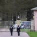Two police officers outside the Royal Lodge