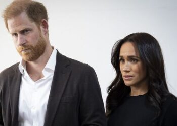 The Duke and Duchess of Sussex looking worried