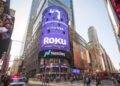 Photo of a Nasdaq logo on the video screen displays outside the Nasdaq exchange building.