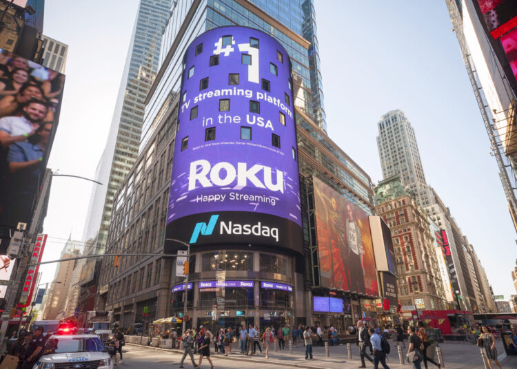 Photo of a Nasdaq logo on the video screen displays outside the Nasdaq exchange building.
