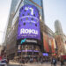Photo of a Nasdaq logo on the video screen displays outside the Nasdaq exchange building.