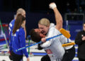 Korey Dropkin and Cory Thiesse of Team USA celebrate winning the Curling Mixed Doubles Semi-final against Amos Mosaner and Stefania Constantini of Italy on Feb. 9, 2026.