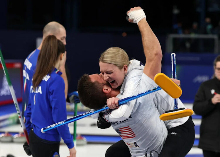 Korey Dropkin and Cory Thiesse of Team USA celebrate winning the Curling Mixed Doubles Semi-final against Amos Mosaner and Stefania Constantini of Italy on Feb. 9, 2026.