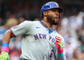 Aug 22, 2025; Cumberland, Georgia, USA; New York Mets outfielder Starling Marte (6) runs to first base after a hit against the Atlanta Braves during he first inning at Truist Park. Mandatory Credit: Jordan Godfree-Imagn Images