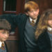 Daniel Radcliffe, Rupert Grint and Emma Watson on set of 2001's Harry Potter and the Sorcerer's Stone Alamy