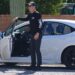 Camron Guthrie, Savannah Guthrie’s brother, standing by an open car door.