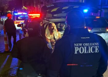Shia LaBeouf, pictured here in police custody, was charged with two counts of battery after allegedly hitting multiple people outside a New Orleans bar on Feb. 17.