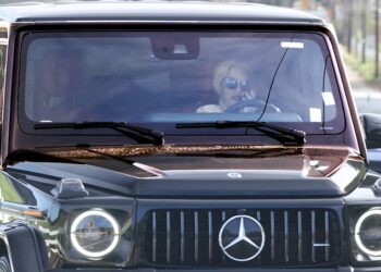 Days after news broke that she sold her music catalog, Spears was spotted driving around Los Angeles with her cell phone pressed to her face