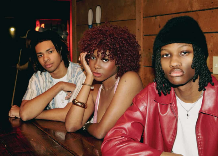 De'Marcus Robateau (from left), a freshman mechanical engineering major, KJ Parker, founder of Talent Co and a sophomore health science major, and D'Mari O'Neal, a first-year finance major, pose for a photo. The Talent Co is a student organization focused on making the entertainment industry more accessible to college students. (Courtesy of Talent Co)