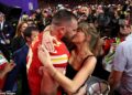 Taylor Swift leads the celebrities who are embracing their WAG era after finding love with NFL players (pictured with fiancé Travis Kelce at the 2024 Super Bowl)
