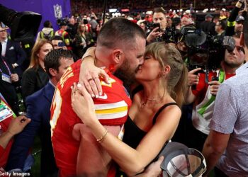 Taylor Swift leads the celebrities who are embracing their WAG era after finding love with NFL players (pictured with fiancé Travis Kelce at the 2024 Super Bowl)