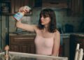 Taylor Swift wears a pink tank top and choker necklace in the opalite music video