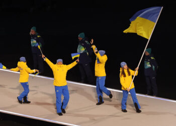 Flagbearer Yelyzaveta Sydorko of Ukraine in the athletes parade during the opening ceremony.