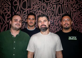 Photo of a band posing for the camera