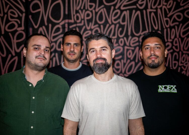 Photo of a band posing for the camera
